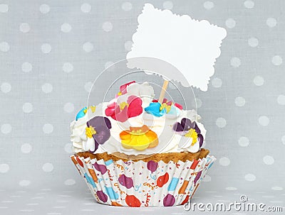 Cupcake with blank card Stock Photo