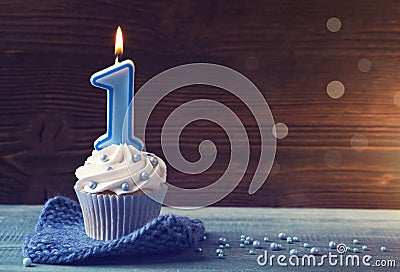 Cupcake with a blue candle Stock Photo