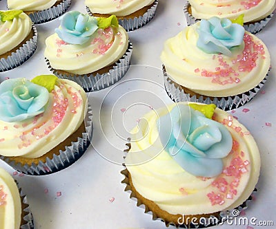 Cupcake blue sugar rose and pink sprinkles Stock Photo