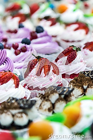 Cupcake cakes with fresh berries on the counter Stock Photo