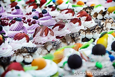 Cupcake cakes with fresh berries on the counter Stock Photo