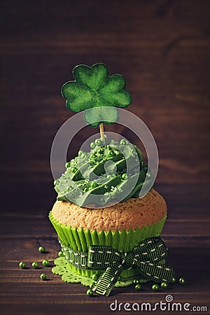 Cupcake with clover cakepick Stock Photo