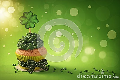 Cupcake with clover cakepick Stock Photo