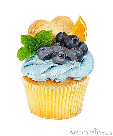 Cupcake with cookies, fresh blueberries, mint and slices of orange Stock Photo