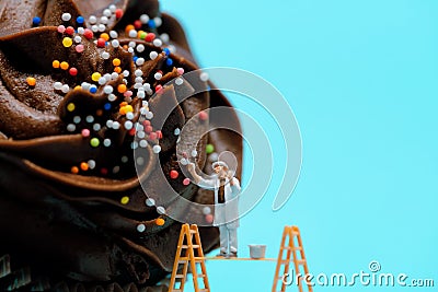 Cupcake creator working on frosting Stock Photo