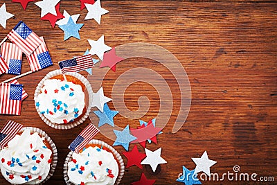 Cupcake decorated with american flag for happy Independence Day 4th july background. Holidays table top view. Stock Photo