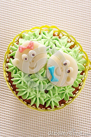 Cupcake decorated with baby faces Stock Photo