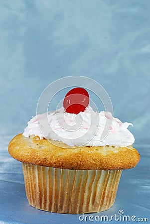 Cupcake with a maraschino on top Stock Photo