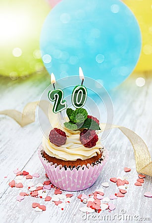 Cupcake with a numeral twenty candle Stock Photo