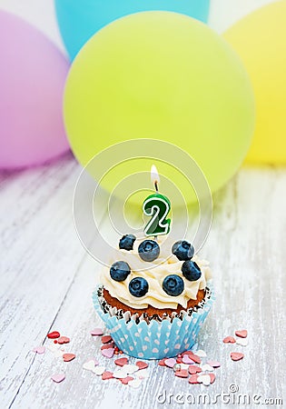 Cupcake with a numeral two candle Stock Photo