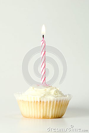 Cupcake with pink candle Stock Photo