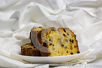 Cupcake with raisins on a white plate morning breakfast close up Stock Photo