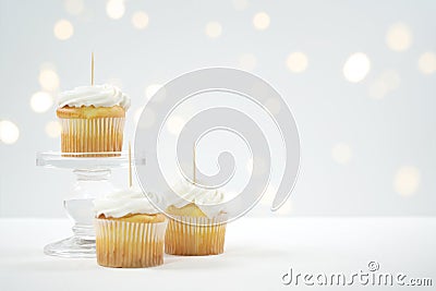 Cupcake Topper Mockup. White background with bokeh party fairy lights. Stock Photo