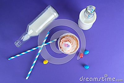 Cupcake for Valentine's Day with hearts on top of whipped cream and milk cocktails with retro cocktail tubes, served in bottles on Stock Photo