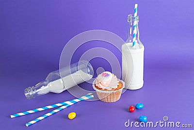 Cupcake for Valentine's Day with hearts on top of whipped cream and milk cocktails with retro cocktail tubes, served in bottles on Stock Photo
