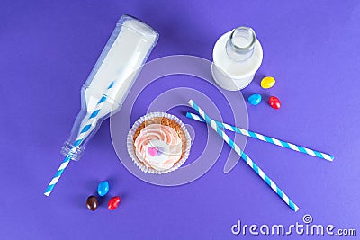 Cupcake for Valentine's Day with hearts on top of whipped cream and milk cocktails with retro cocktail tubes, served in bottles on Stock Photo