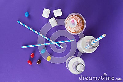 Cupcake for Valentine's Day with hearts on top of whipped cream and milk cocktails with retro cocktail tubes, served in bottles on Stock Photo