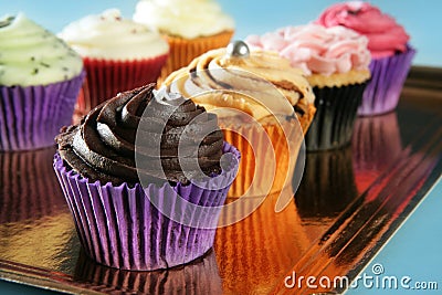 Cupcakes colorful cream muffin arrangement Stock Photo