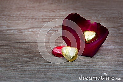 A cupcakes with heart shape chocolate on wooden table Stock Photo