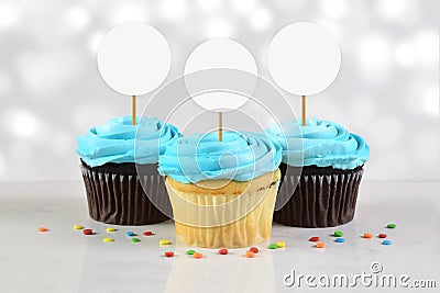 Cupcakes Mockup with Three Blue Frosted Cupcakes Stock Photo