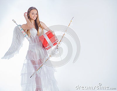 Cupid cute angel with bow and arrows - Concept of Valentines Day. Angelic character. Lovely girl. Cherub girl. Lovely Stock Photo