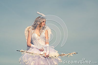 Cupid cute angel with bow and arrows. Teenager Cupid - Valentine concept. St Valentines day. Teen angel. Innocent girl Stock Photo