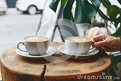 Cups of aromatic coffee cappuccino Stock Photo