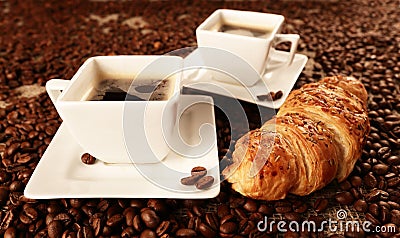 Cups with coffee and coffee beans Stock Photo