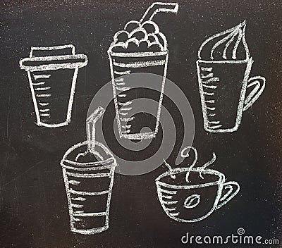 Cups with coffee drawn in chalk on a blackboard. Stock Photo