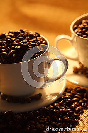 Cups of coffee, full of beans. Stock Photo