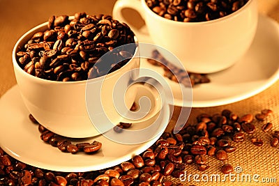 Cups of coffee, full of beans. Stock Photo