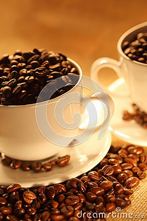 Cups of coffee, full of beans. Stock Photo