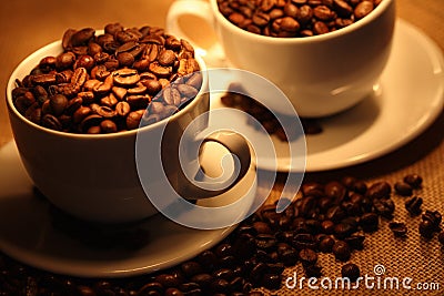 Cups of coffee, full of beans. Stock Photo