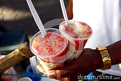 Cups of strawberry and milk flavored Taho with Sago Stock Photo