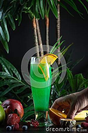 Curacao lemonade in a glass decorated with an orange slice Stock Photo