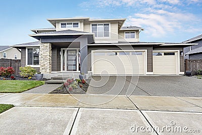 Curb appeal of brand-new home in brown and beige colors Stock Photo