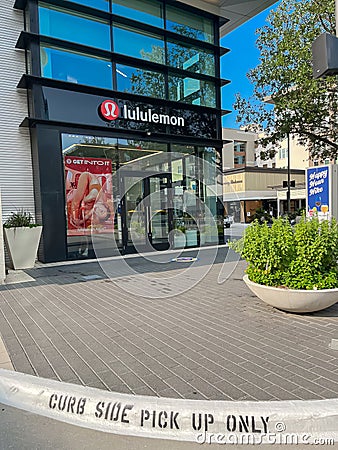 Curb side pickup at store front of Lululemon faÃ§ade entrance in urban Legacy West lifestyle center in Plano, Texas Editorial Stock Photo