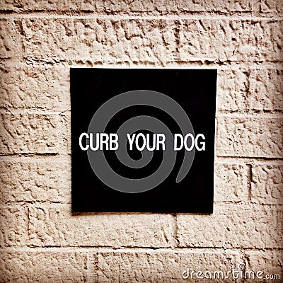 Curb Your Dog Sign Stock Photo