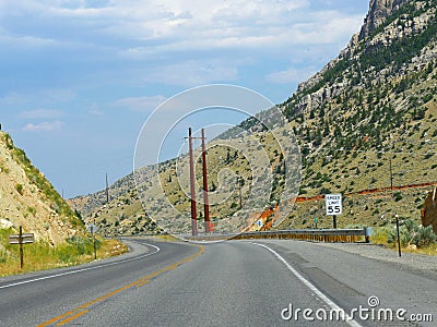 Paved road approaching the Buffalo Bill dam and tunnel, Wyoming`s longest tunnel Stock Photo