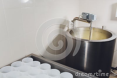 curdled milk brought to high temperature for the production of cheese in the dairy. Stock Photo