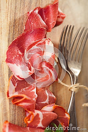 Cured Meat and vintage forks Stock Photo