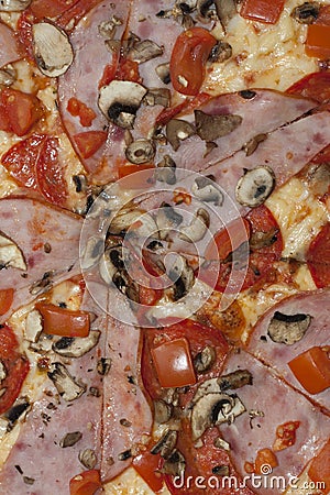 Cured parma ham on a Traditional Italian pizza with mozzarella cheese and tomato on a thick pastry photo Stock Photo