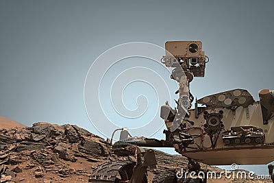 Curiosity Mars Rover exploring the surface of red planet. Stock Photo