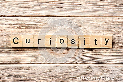 Curiosity word written on wood block. curiosity text on table, concept Stock Photo