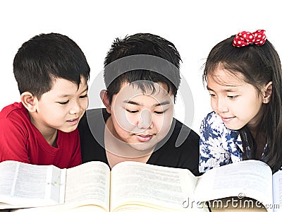 Curious children reading book Stock Photo