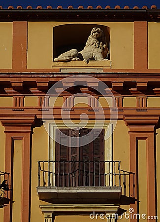 Curious detail of balcony and sculpture in Malaga. Spain. Stock Photo