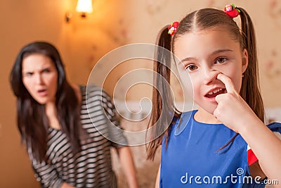 Curious girl picking a nose Stock Photo