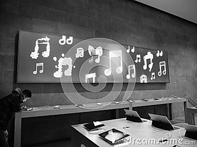 Curious male admiring the Apple Macbook Pro laptop Editorial Stock Photo