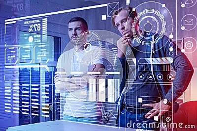 Curious programmer looking at the screen while testing a new program Stock Photo
