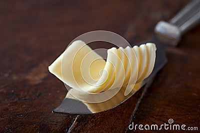 Curl of butter on a vintage butter knife Stock Photo